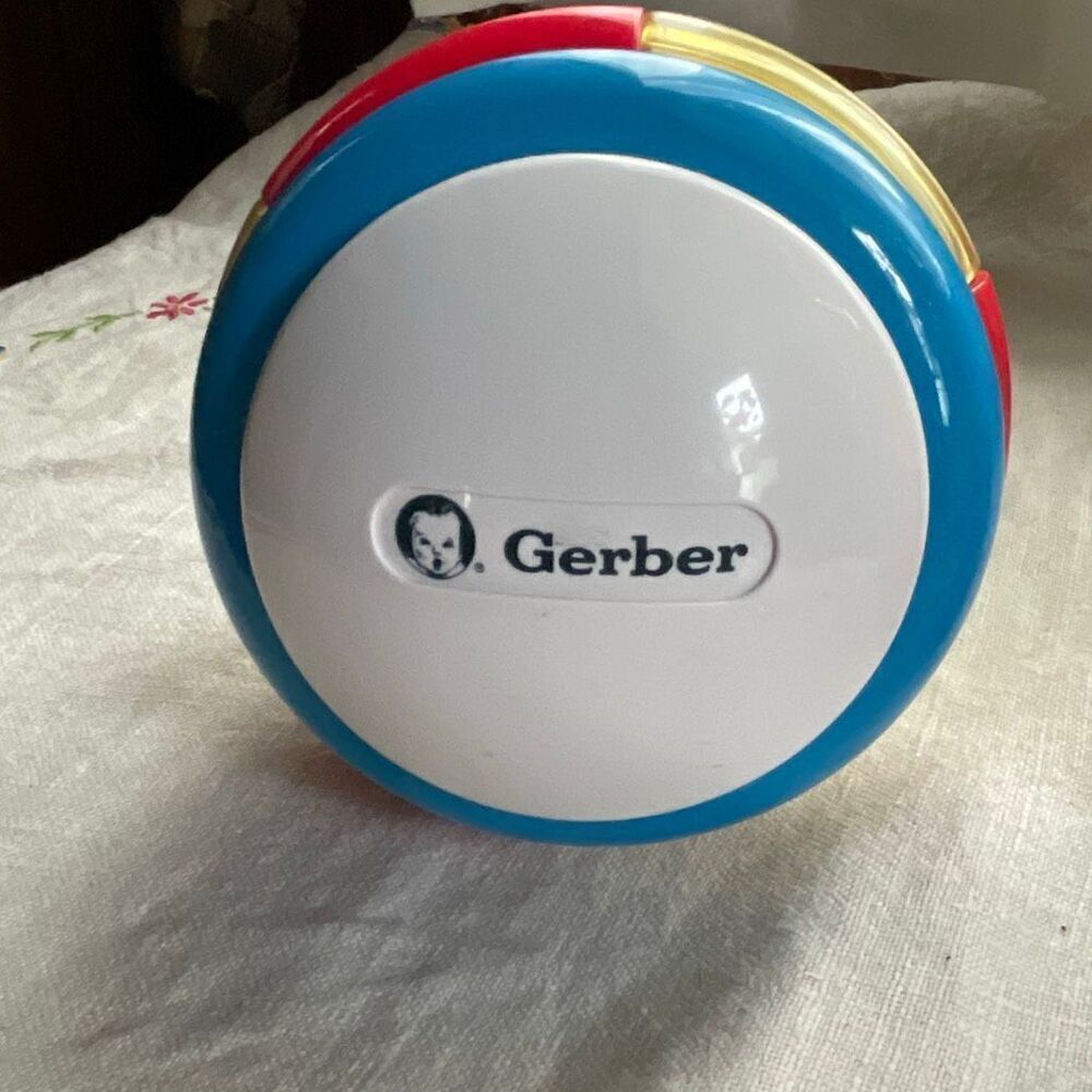 1996, Ring ‘n Roll Gerber Products Co. Toy Biz, Inc roundish rolling rattle infa